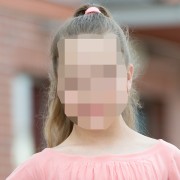 Pixelated photo of tween girl with long hair